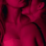 two woman wearing brassieres