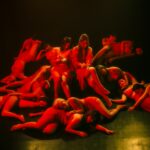 a group of people in red clothing