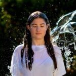 water splash on woman's to face