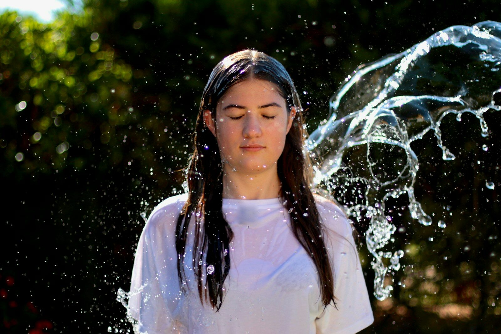 water splash on woman's to face