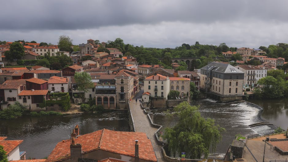 A picturesque aerial view of Clisson in Pays de la Loire, featuring historic architecture and lush greenery.
