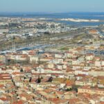 Aerial view of Sète, France with its vibrant rooftops and harbor.