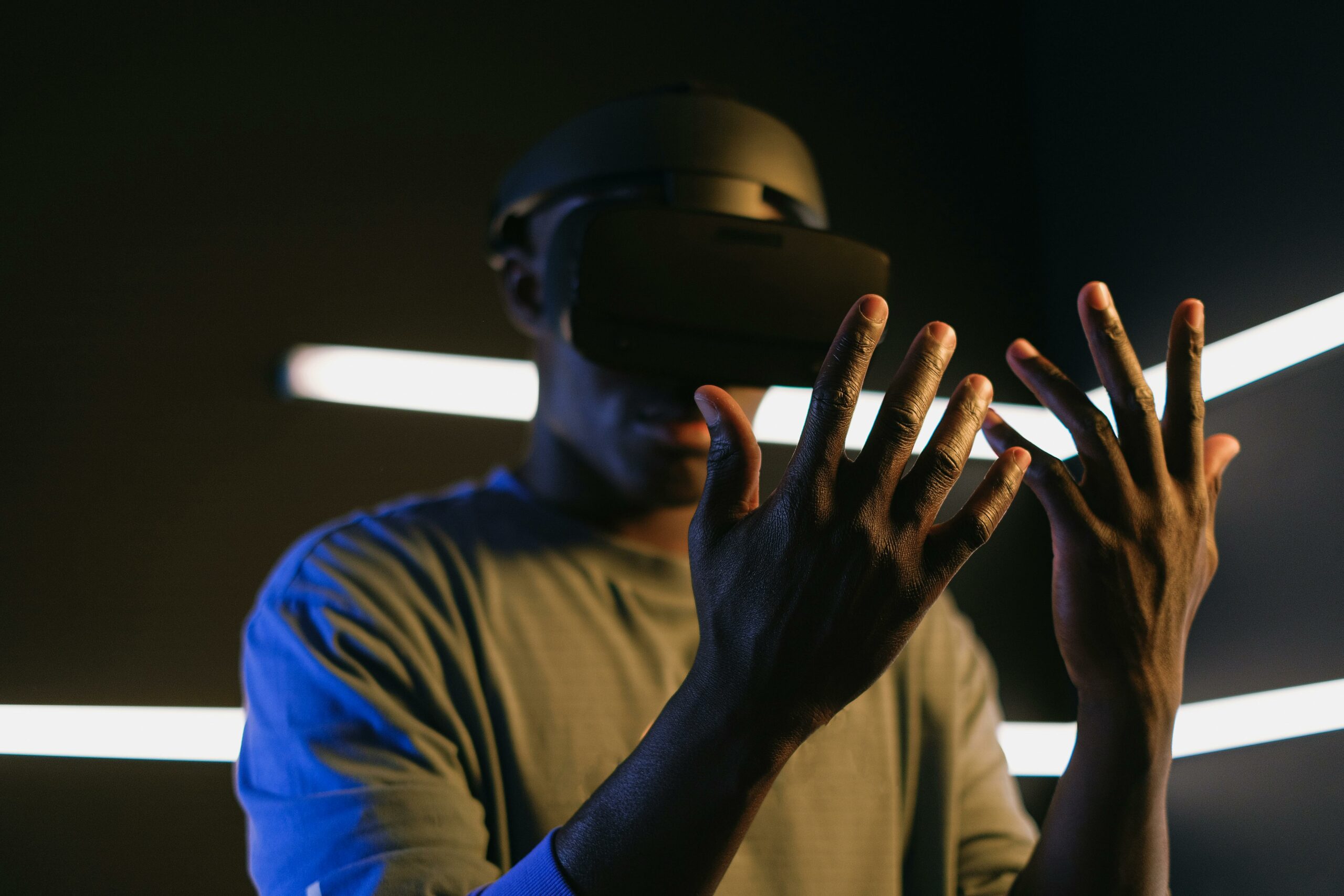 Focused view of a person using VR goggles and exploring virtual reality. Captures modern technology theme.